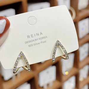 Detailed macro view of geometric V-shaped earrings with micro-paved rhinestones and 925 silver posts