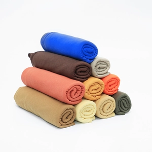Soft jersey cotton headscarves stacked in multiple vibrant colors for winter fashion