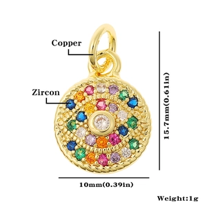 Detailed macro view of a gold-plated copper pendant featuring colorful zircon stones