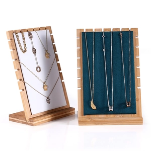 Bamboo necklace display stand with white and navy velvet pads for jewelry storage