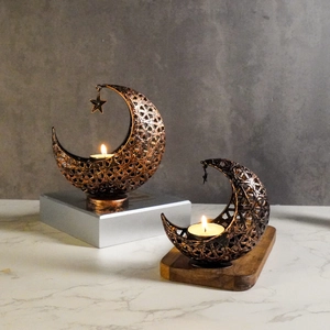 Hollow crescent moon metal candle holders with hanging stars in vintage copper finish