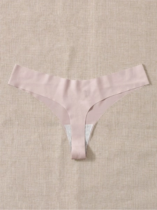 Close-up of seamless pink sports thong with a grey cotton crotch lining for comfort