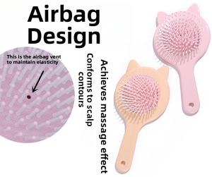Detailed view of cat ear hairbrush showing air cushion vent and flexible bristles