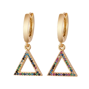 Close-up of golden triangle drop earrings with multi-color cubic zirconia inlay