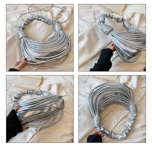 Detailed views of a silver metallic pleated handbag showing texture and soft handle design