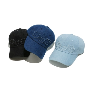 Three colors of denim baseball caps with vintage floral embroidery in a row