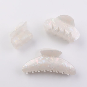 Three-piece set of iridescent white pearl hair claws in large, medium, and small sizes