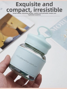 Detail of blue heat-resistant sleeve on chubby glass cup with phone holder function