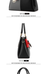 Detail view of large multi-color leather handbag showing side profile and stitch texture