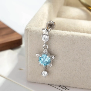 Exquisite sparkling blue star naval piercing in polished 316L stainless steel jewelry