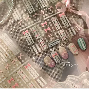 Detail of 5D embossed nail stickers with snowflake, sweater texture and pink bow designs