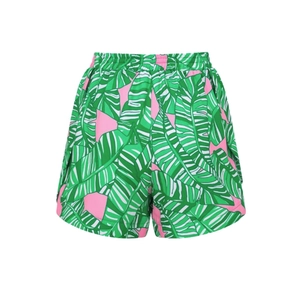 Detailed view of tropical green leaf print on pink high-waisted surfing shorts