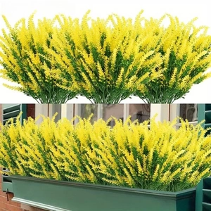 Detail of yellow artificial lavender bouquet in outdoor window box for home decoration