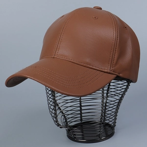 Detail of brown PU leather baseball cap with lychee texture on wire frame stand