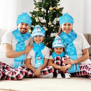 Family wearing blue Christmas knit hat and scarf set with snowman and snowflake patterns