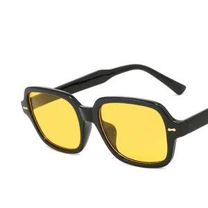Retro oversized square sunglasses with black frame, yellow lenses and gold metal rivets