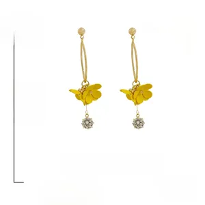 Detail of long floral earrings with S925 silver needle, yellow petals and crystal drops