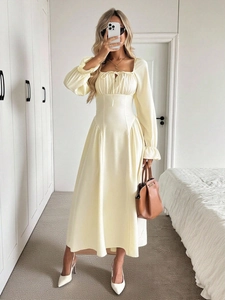 Elegant cream yellow square neck pleated midi dress with long sleeves and A-line skirt