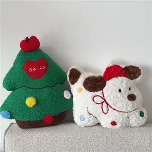 Detail of Christmas tree plush pillow with colorful pom poms and cute dog decorative cushion