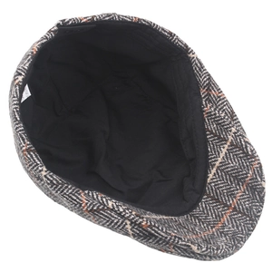 Top view of men's wool newsboy cap showing grey herringbone pattern and black inner lining