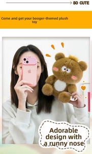 Close-up of fluffy brown plush bear with funny runny nose design held by a model