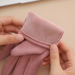 Close-up of pink gloves showing thick plush lining and thermal warmth insulation