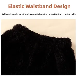 Detail of wide elastic waistband on soft black flannel pajamas for kids comfort