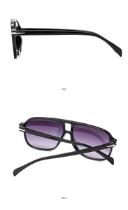 Detail of pilot sunglasses with glossy black frames and purple gradient lenses