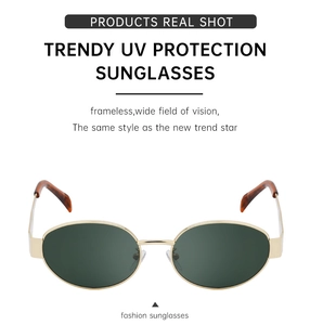 Detail of vintage gold metal sunglasses with dark green lenses and UV protection