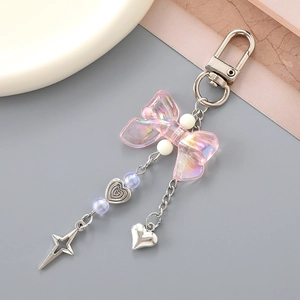 Iridescent pink bow keychain with silver heart charm and star pendant for bag