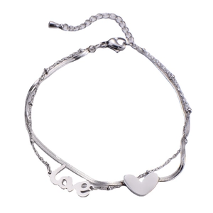 Double-layered silver bracelet featuring a 'Love' tag and heart pendant with snake chain