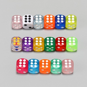 Set of colorful transparent resin six-sided dice in various bright colors for board games