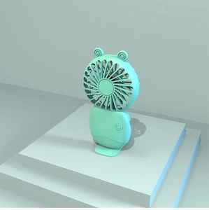 Mint green portable USB handheld fan with cute ears on a tiered display stand