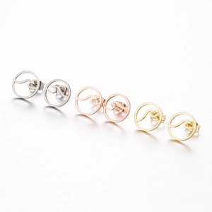 Three pairs of wave-pattern round stud earrings in silver, gold, and rose gold stainless steel