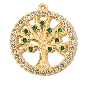 Detailed shot of golden Tree of Life pendant with white rhinestones and green crystals