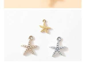 Detailed view of starfish pendants in gold, silver, and rose gold alloy finishes