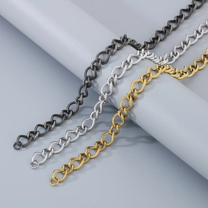 Detail of twisted curb chains in black, silver, and gold with lobster clasps