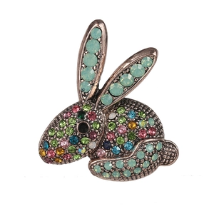Vintage style cute rabbit brooch with colorful rhinestones on a polished bronze base