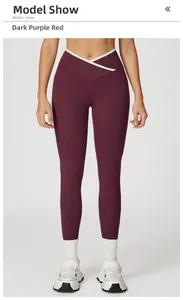 Vooraanzicht van donkerpaarsrode yoga-leggings met hoge taille en witte V-kruis tailleband