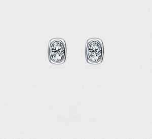 Macro detail of oval-cut zircon earrings in S925 sterling silver bezel setting