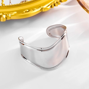 Polished silver wide open cuff bracelet in minimalist wave design made of titanium steel
