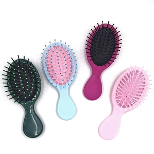 Portable air cushion hair brushes in pink, purple, blue, and green for hair scalp massage