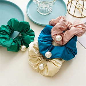 Set of four satin scrunchies with large pearl pendants in green, blue, pink, and beige