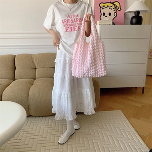 Detailed texture of pink and white striped bubble cloud tote bag in a lifestyle setting
