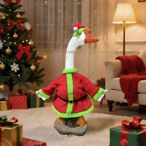 Detail view of porch goose resin statue wearing red and green Christmas outfit and hat
