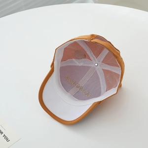Internal view of kids dinosaur baseball cap showing mesh panels and embroidery