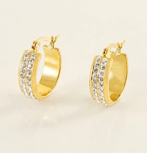 Close-up of gold stainless steel hoop earrings with double row crystal pavé stones