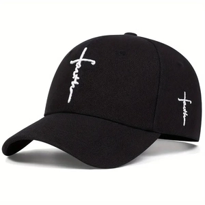 Close-up of white 3D faith embroidery with cross symbol on a black cotton baseball cap