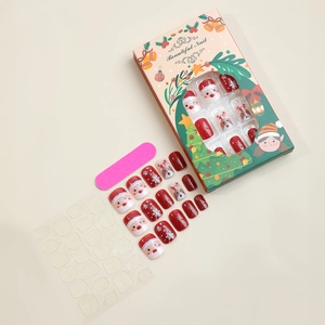 Christmas press-on nail kit with 24 pieces featuring reindeer, snowflakes and glitter designs