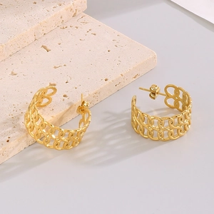 Retro hollow chain-link C-shape gold-plated earrings on beige stone background